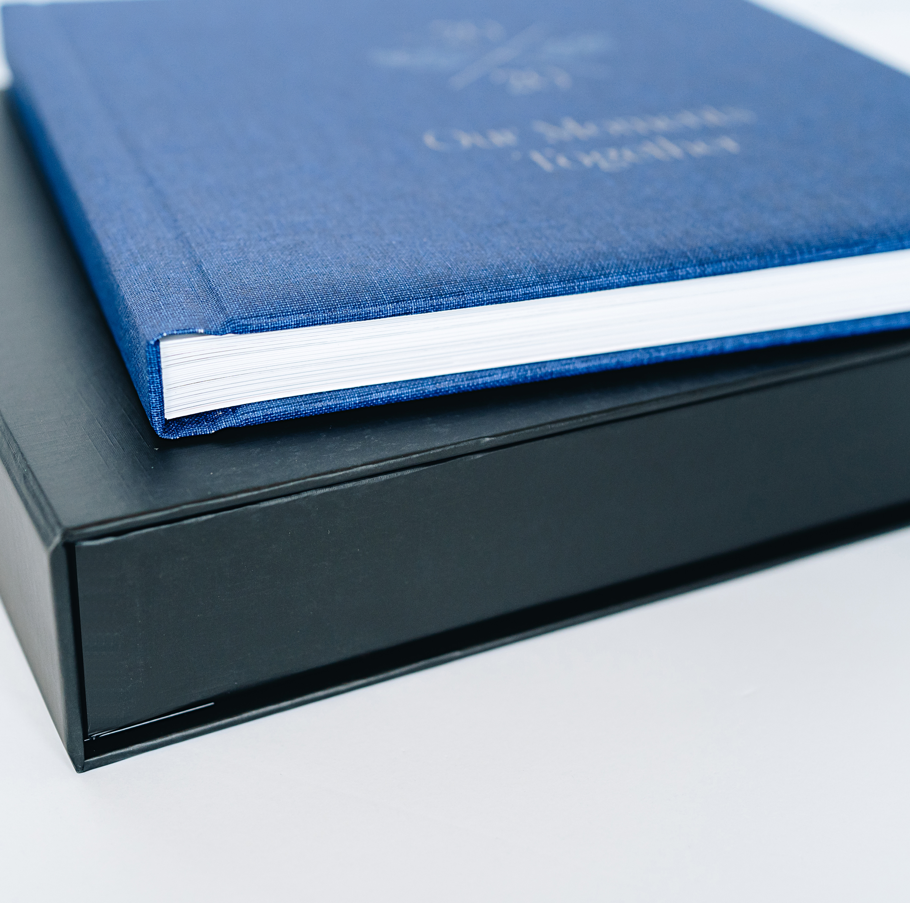 Photo book storage box with a blue linen photo book
