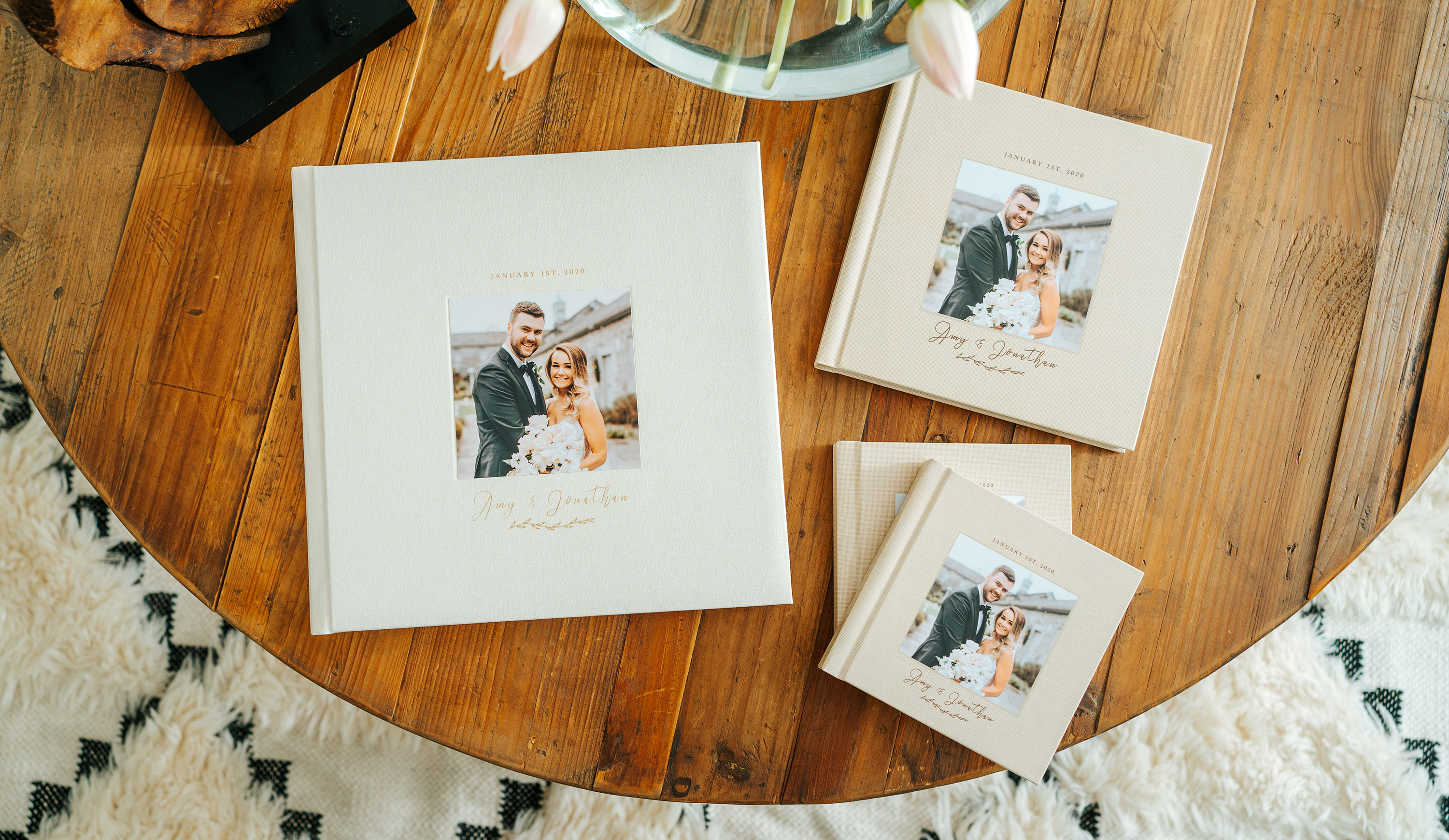 Parent wedding album copies laying on wooden table