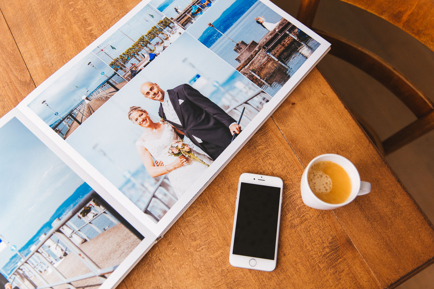 Flat lay wedding album open on table