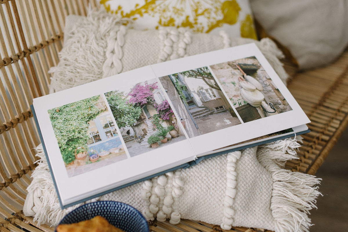 Luxury photo album laying on sofa cushion