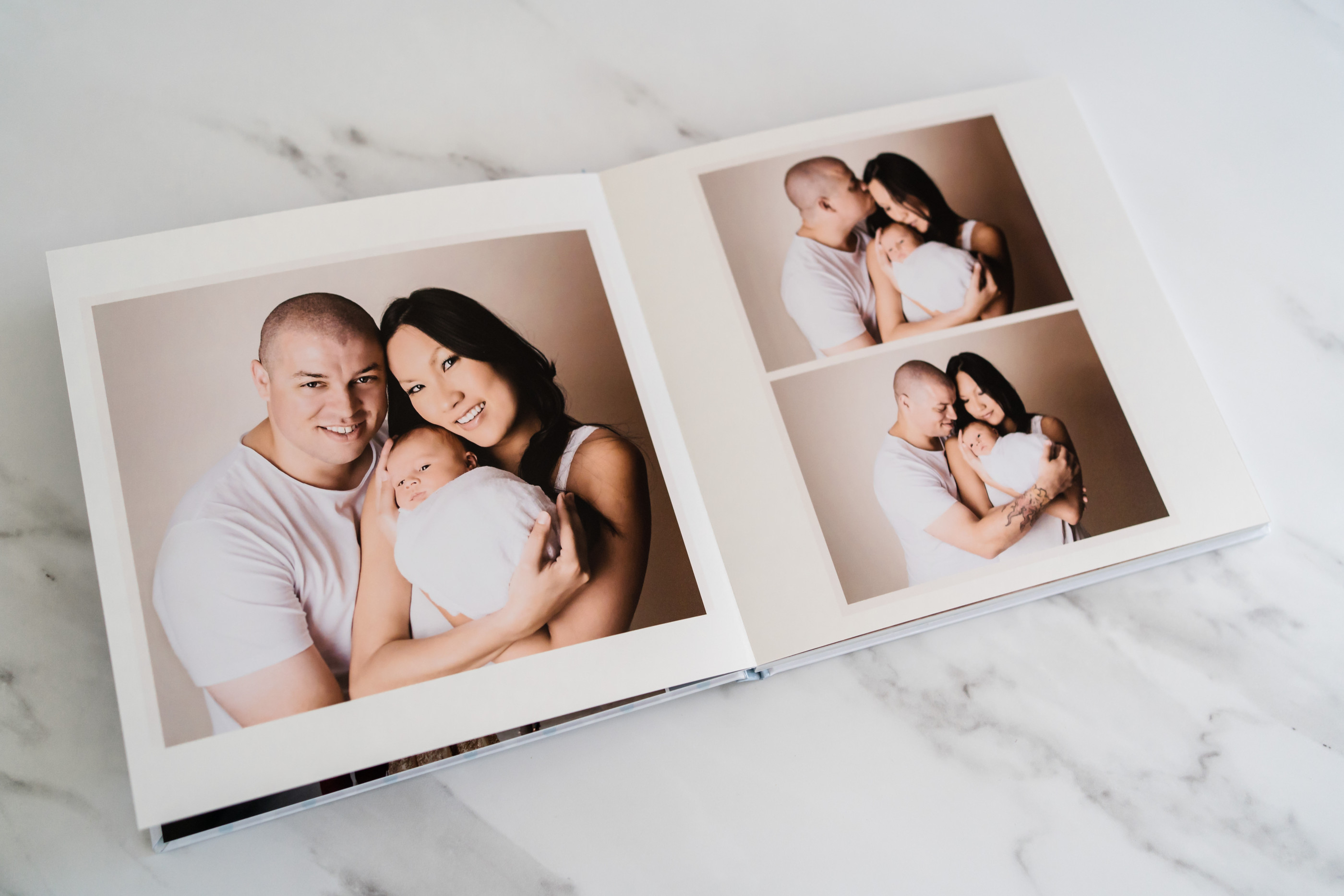Family photo album showing couple with baby