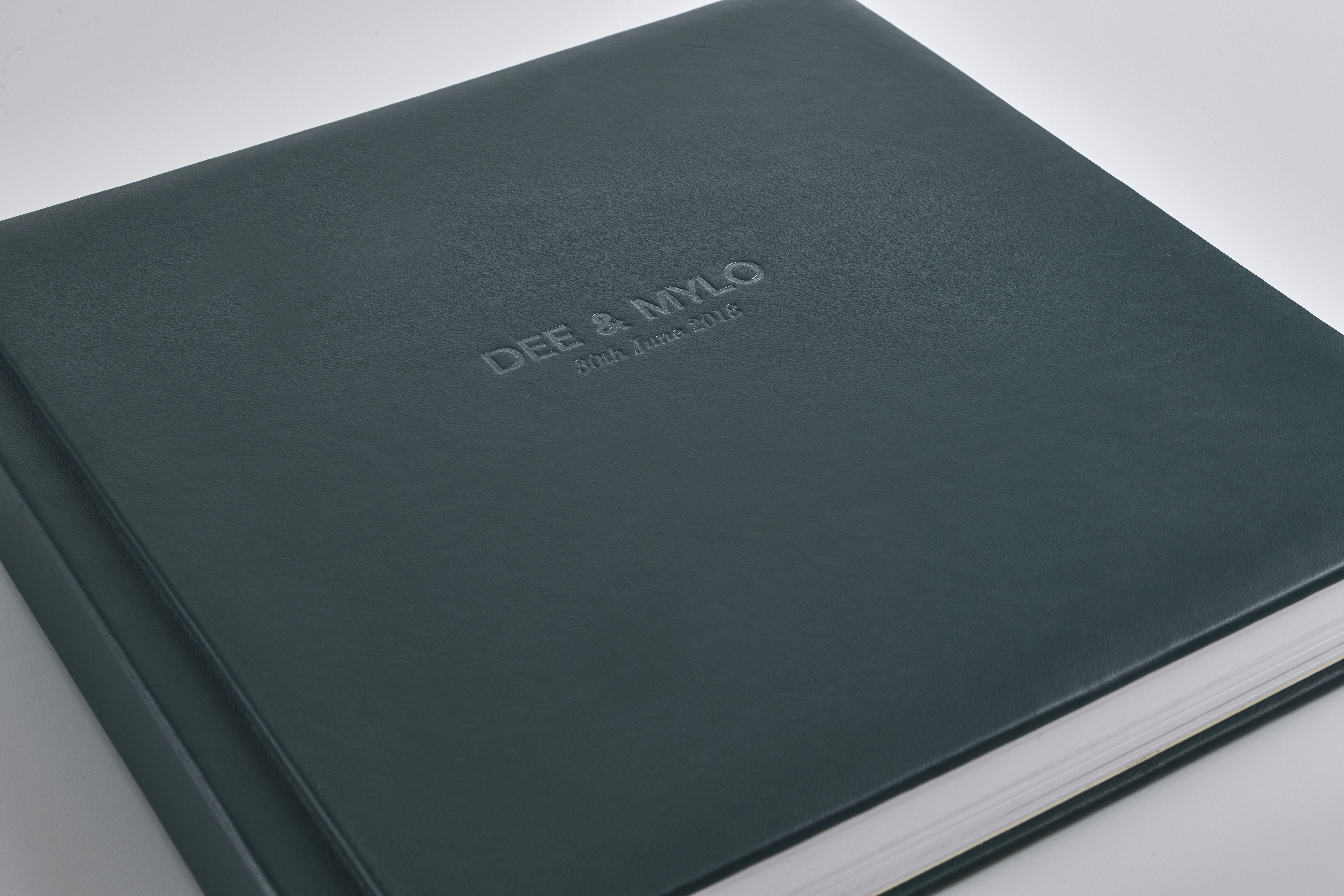 Details of a custom leather photo album with embossed title