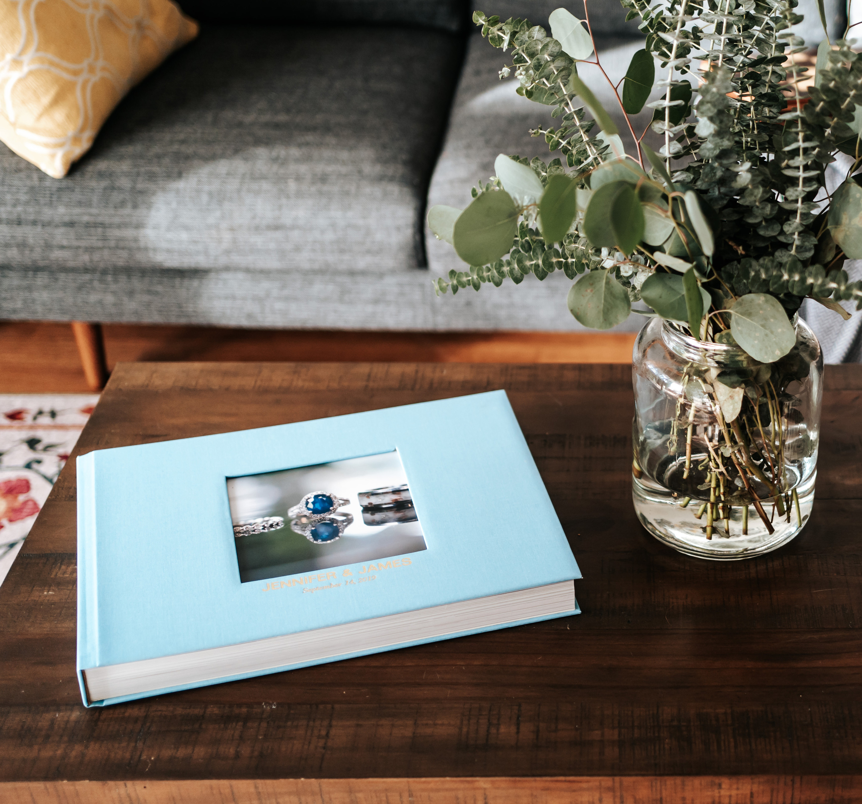 Luxury wedding photo book on coffee table