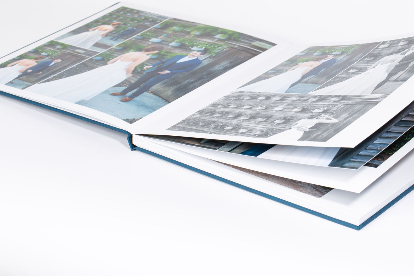 A open premium layflat album showing thick pages