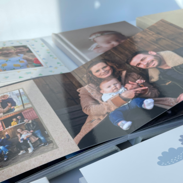 Flat lay image displaying a variety of PikPerfect photo book layouts