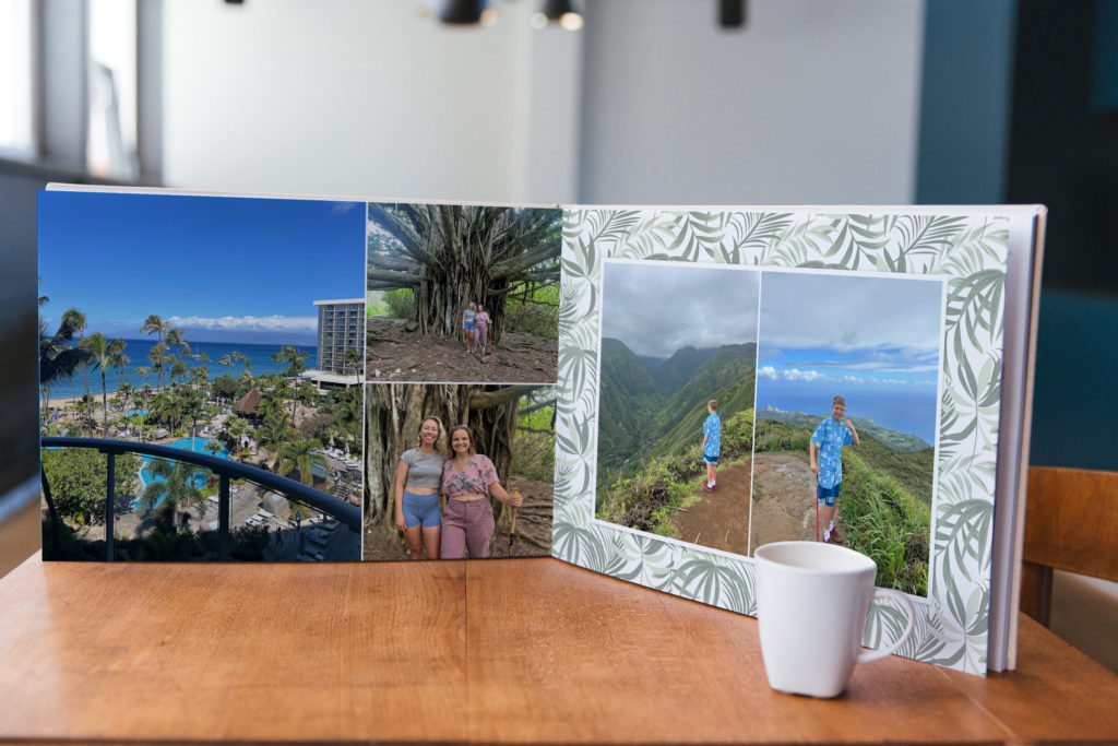 Open travel photo book showing Maui beach, forest, and mountain scenes, enhanced with nature-inspired backgrounds from the Destination layout design style by PikPerfect