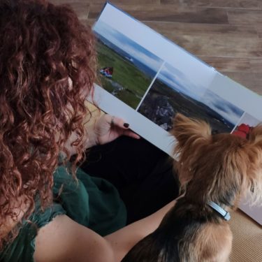 Turning pictures into a photo book—flipping through printed memories at home