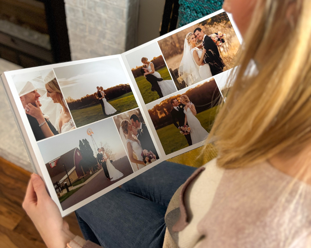 Bride reviewing a photo wedding album with curated images from her special day