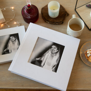 Elegant photo wedding album with cameo window cover featuring a smiling bride, perfect for making a personalized wedding album keepsake