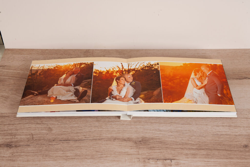 Layyflat wedding album with full photo printed seamlessly across two pages, no center crease.