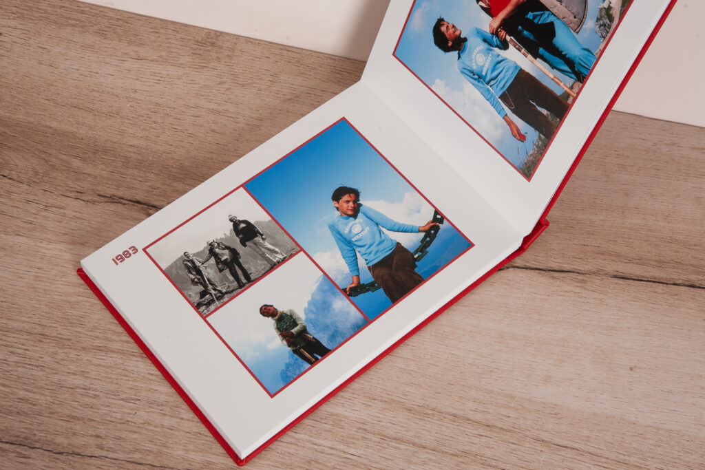 Inside spread of the family photo album featuring childhood photos from the 80s with custom red borders.