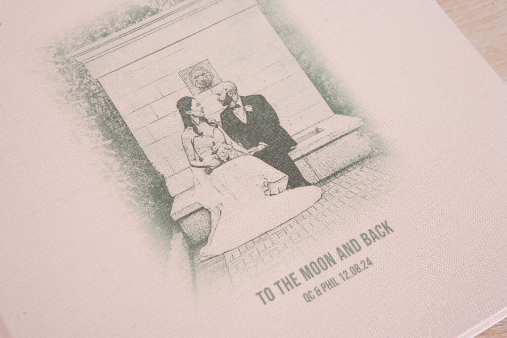 Close-up of UV-printed custom sketch on a rose linen wedding album cover.