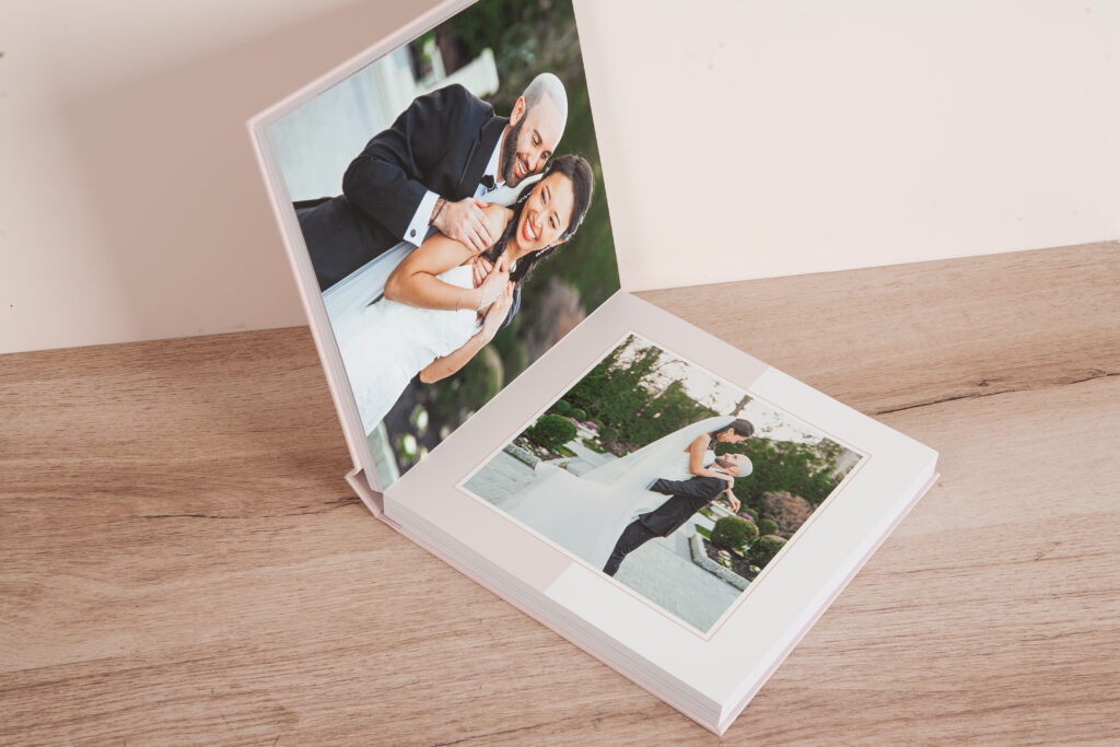 Interior spread of a custom layflat wedding album blending floral, foliage, and color-block design elements. The featured spreads shows the color blocks design style.